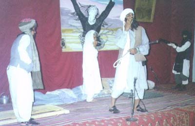 A scene of a play about criminality of Taliban against women presented at the function