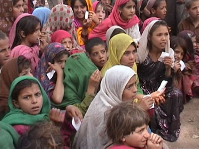 The card holder children in queue to receive aid