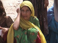 One of thousands of ruined children in the camp waiting to receive aid