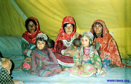 Displaced women in their tent