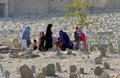 Women gathered in grave yard to remember their loved ones.