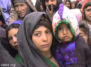 Women waiting to receive food from RAWA